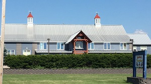 Renovated barn sleek modern exterior 2 cupolas