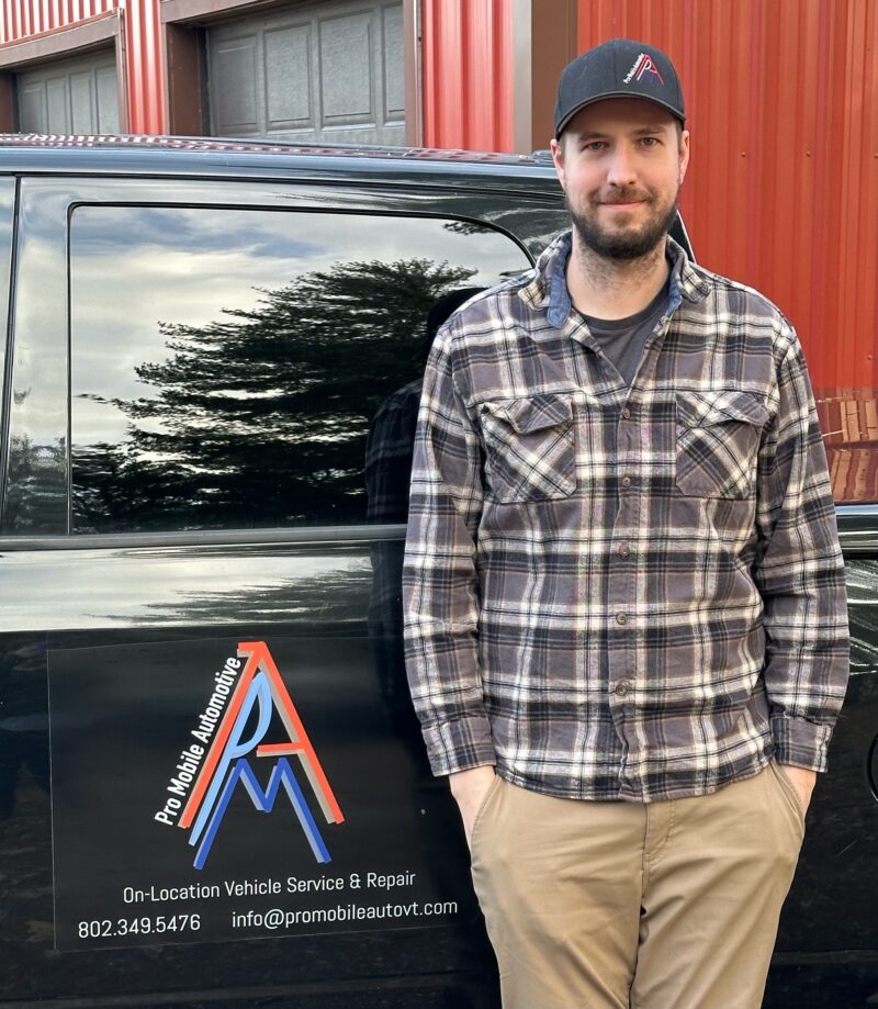 Pro Mobile Automotive co-owner Allen Laberge stands in front of his work truck