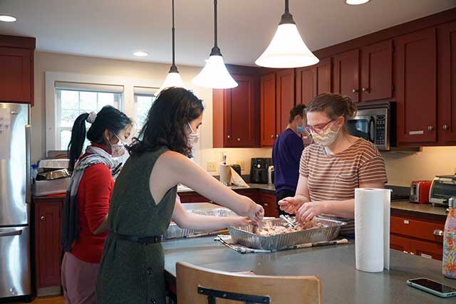 Students who are part of the Charter House Coalition student organization cook and deliver meals for Charter House each week.