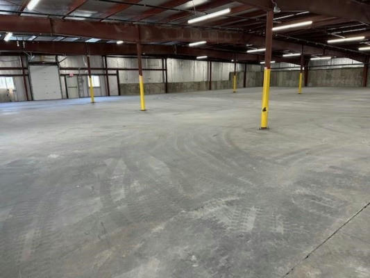 interior of empty warehouse, concrete floor.