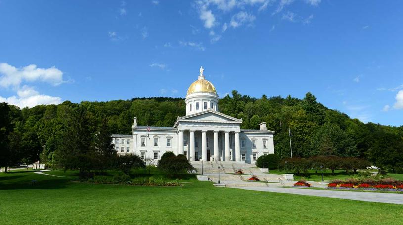 A photo of the Vermont State House in summer