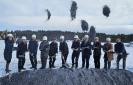 Throwing dirt at the groundbreaking for the Stonecrop Meadows housing project in Middlebury.