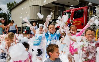 Kids playing with bubbles at a Vergennes Day event