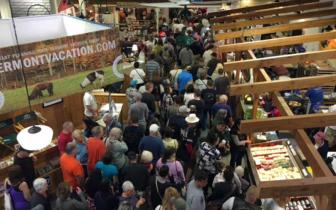 A photo of the crowd in the Vermont Building a the Big E fair, seen from above